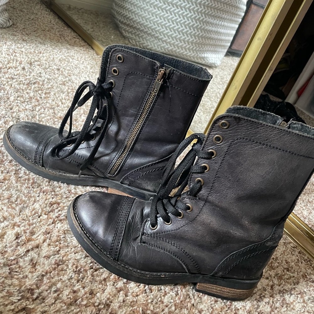Black leather combat boots.